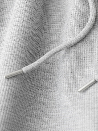 Calça de perna reta com listras contrastantes e textura waffle