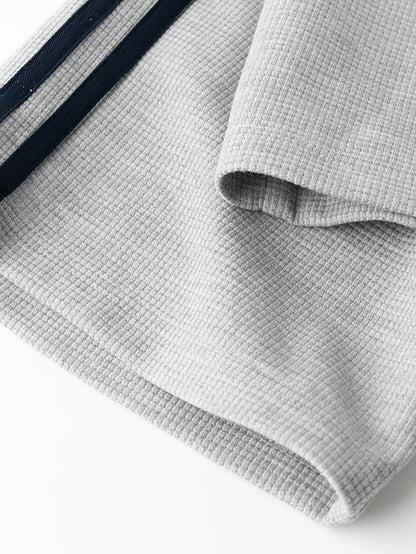 Calça de perna reta com listras contrastantes e textura waffle