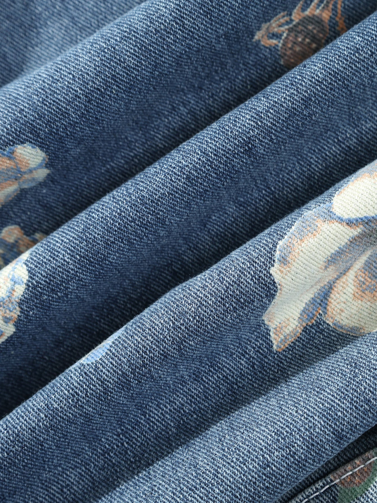 Jaqueta jeans lavada de modelagem ampla com estampa floral