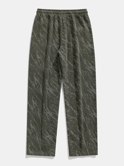 Calça de veludo cotelê com estampa marmorizada e perna reta